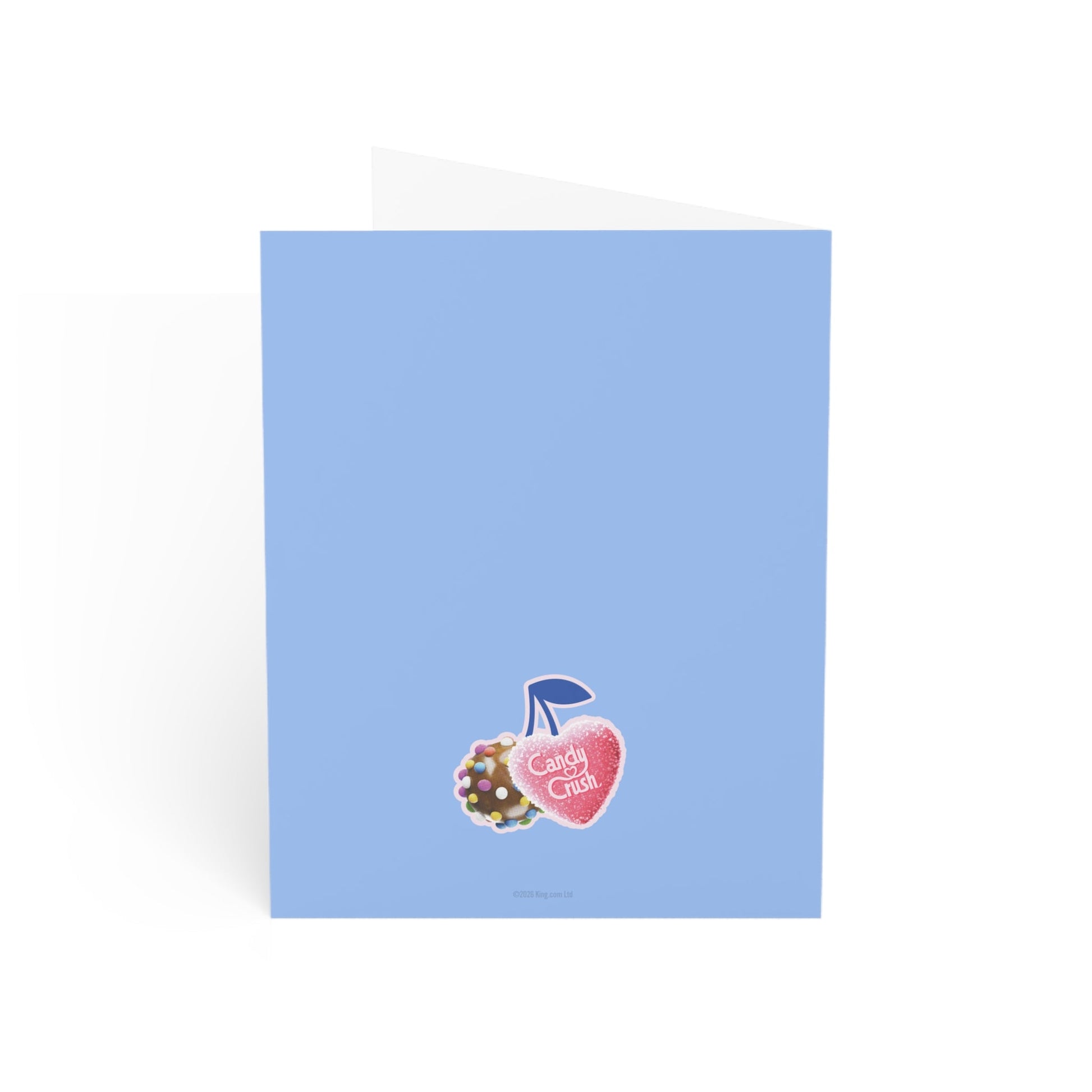 The Candy Crush greeting card displayed next to its included white envelope.
