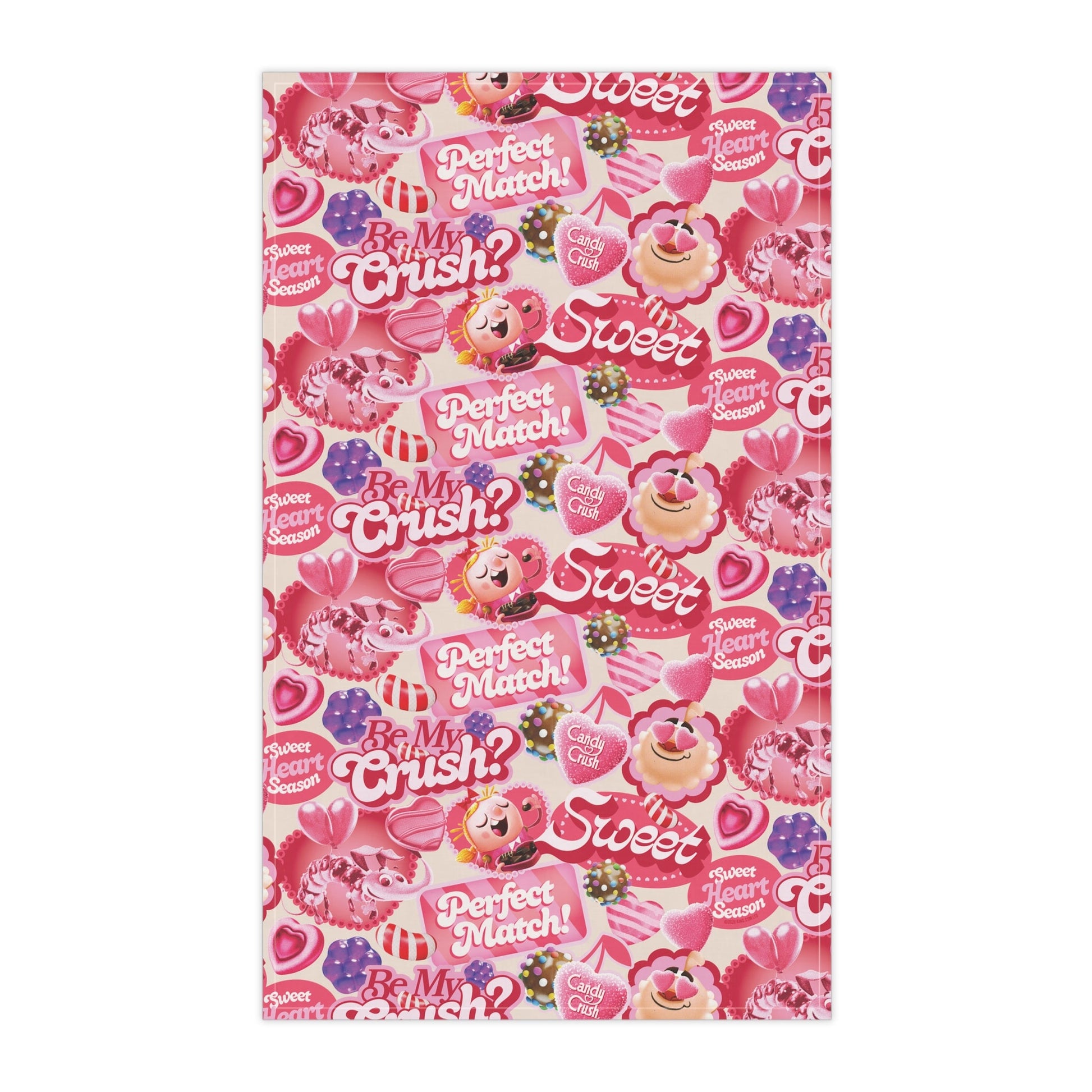 Lifestyle view of the Candy Crush towel hanging in a brightly lit kitchen setting