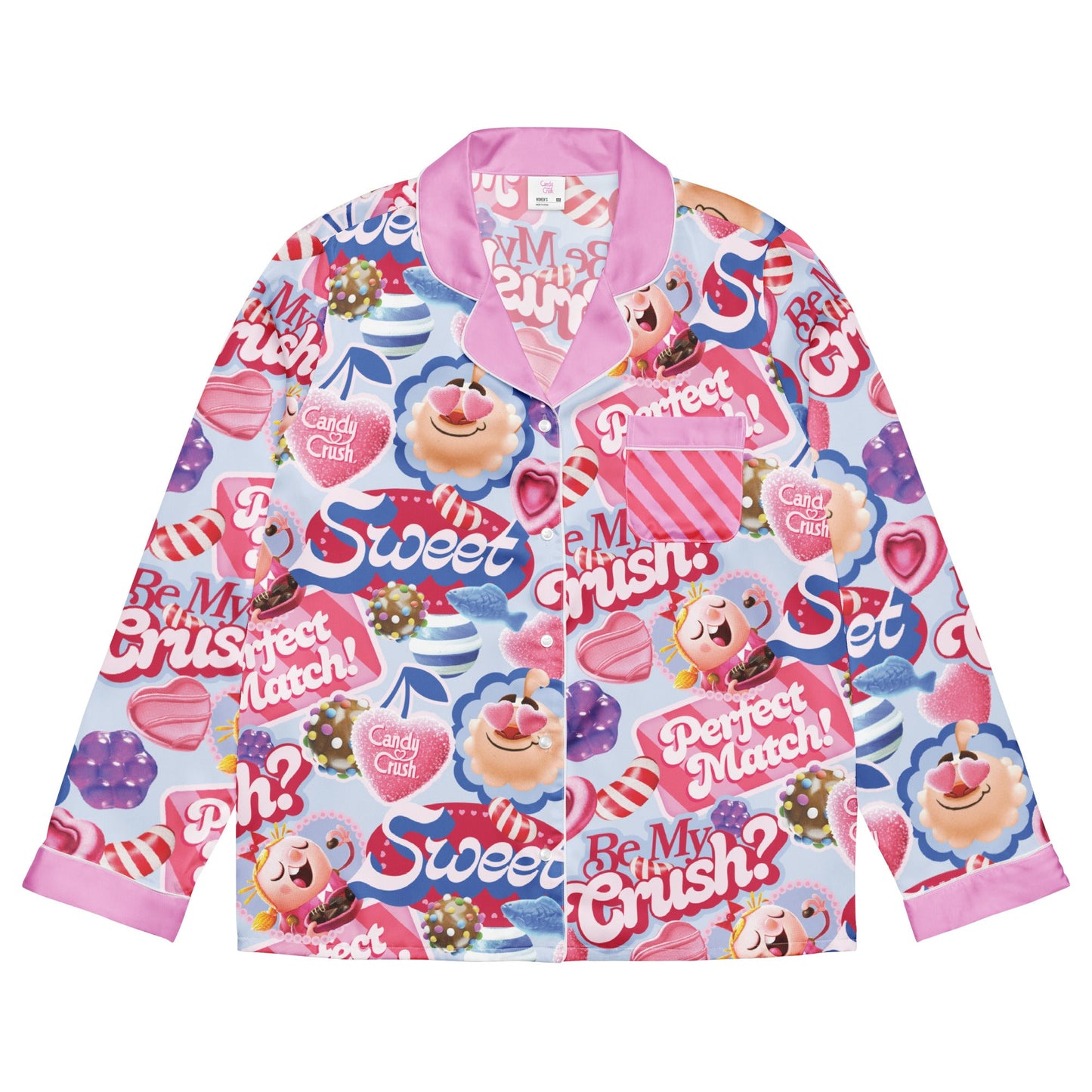 An adult woman wearing a vibrant Candy Crush long sleeve shirt with Be My Crush? printed on the front.