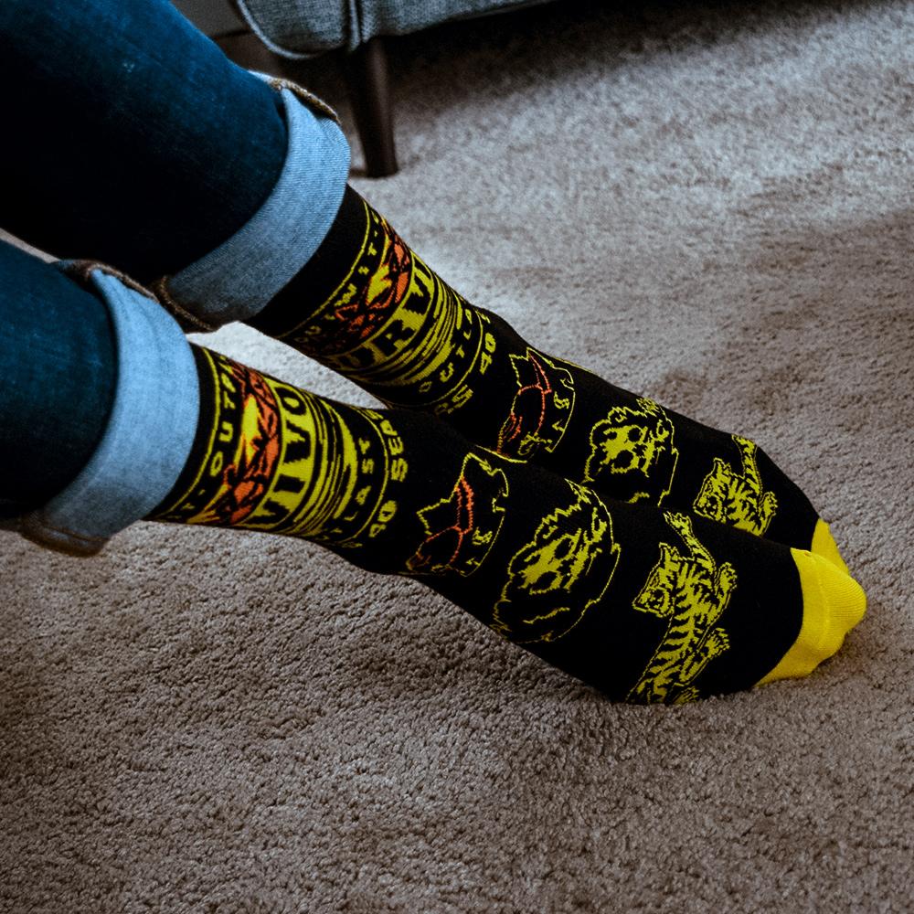 Survivor 20 Years 40 Seasons All Over Black and Yellow Tribal Pattern Socks | Official CBS Entertainment Store