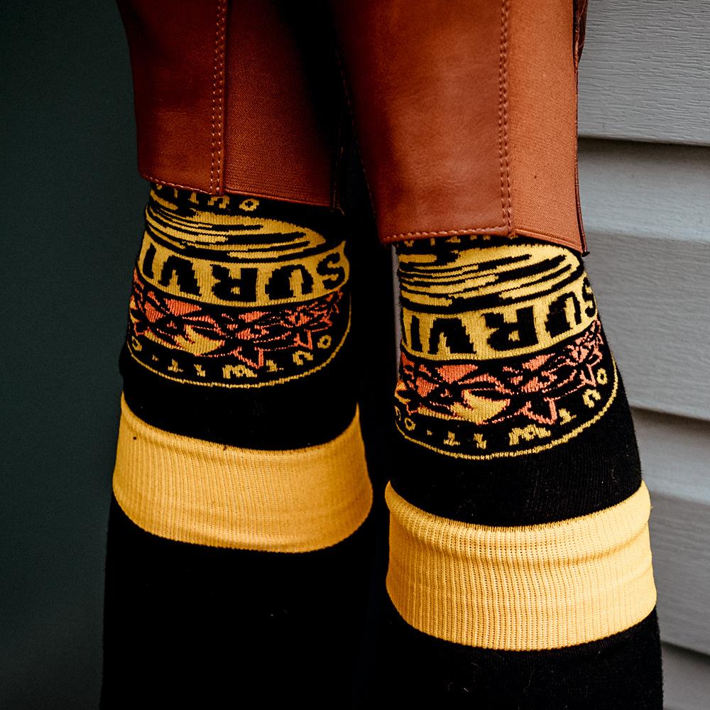 Survivor 20 Years 40 Seasons All Over Black and Yellow Tribal Pattern Socks | Official CBS Entertainment Store